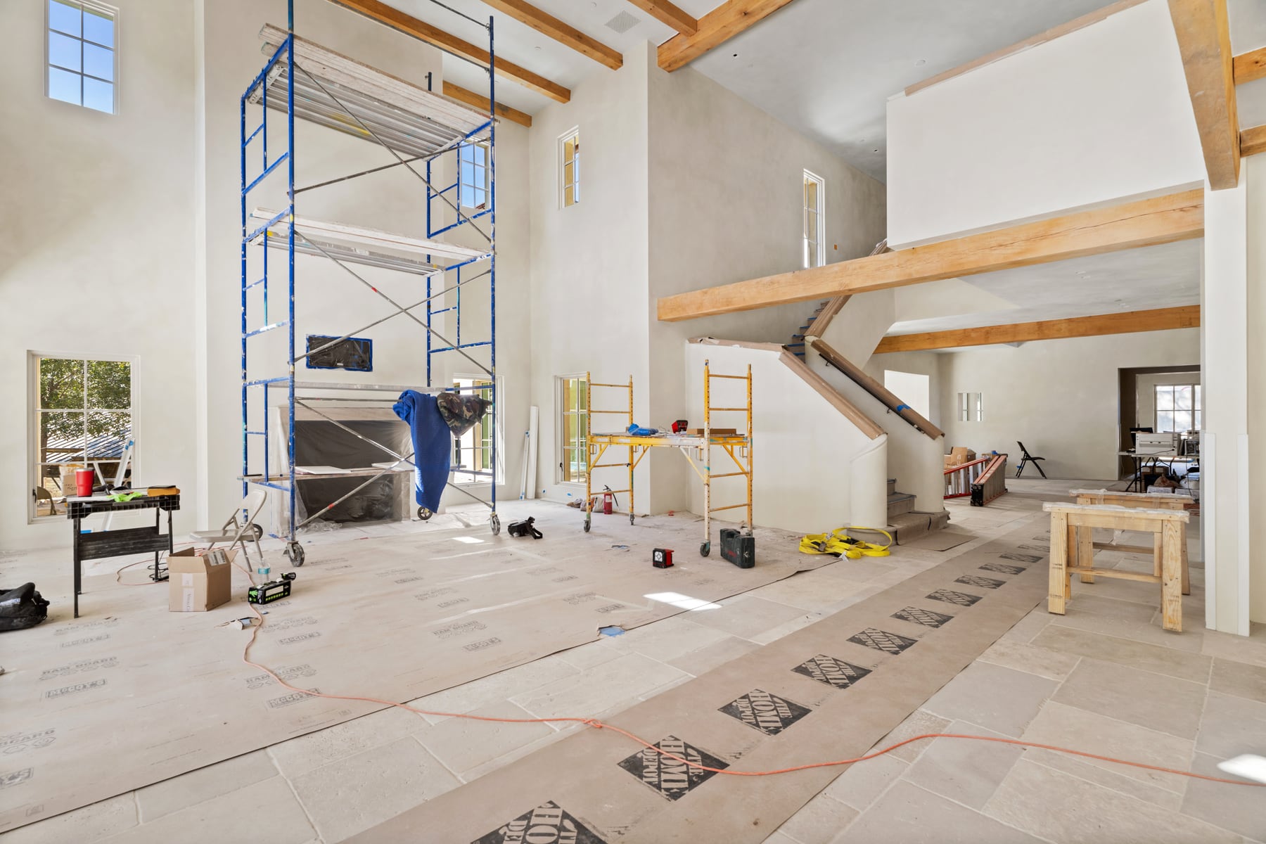 Large new construction living area with finish work underway