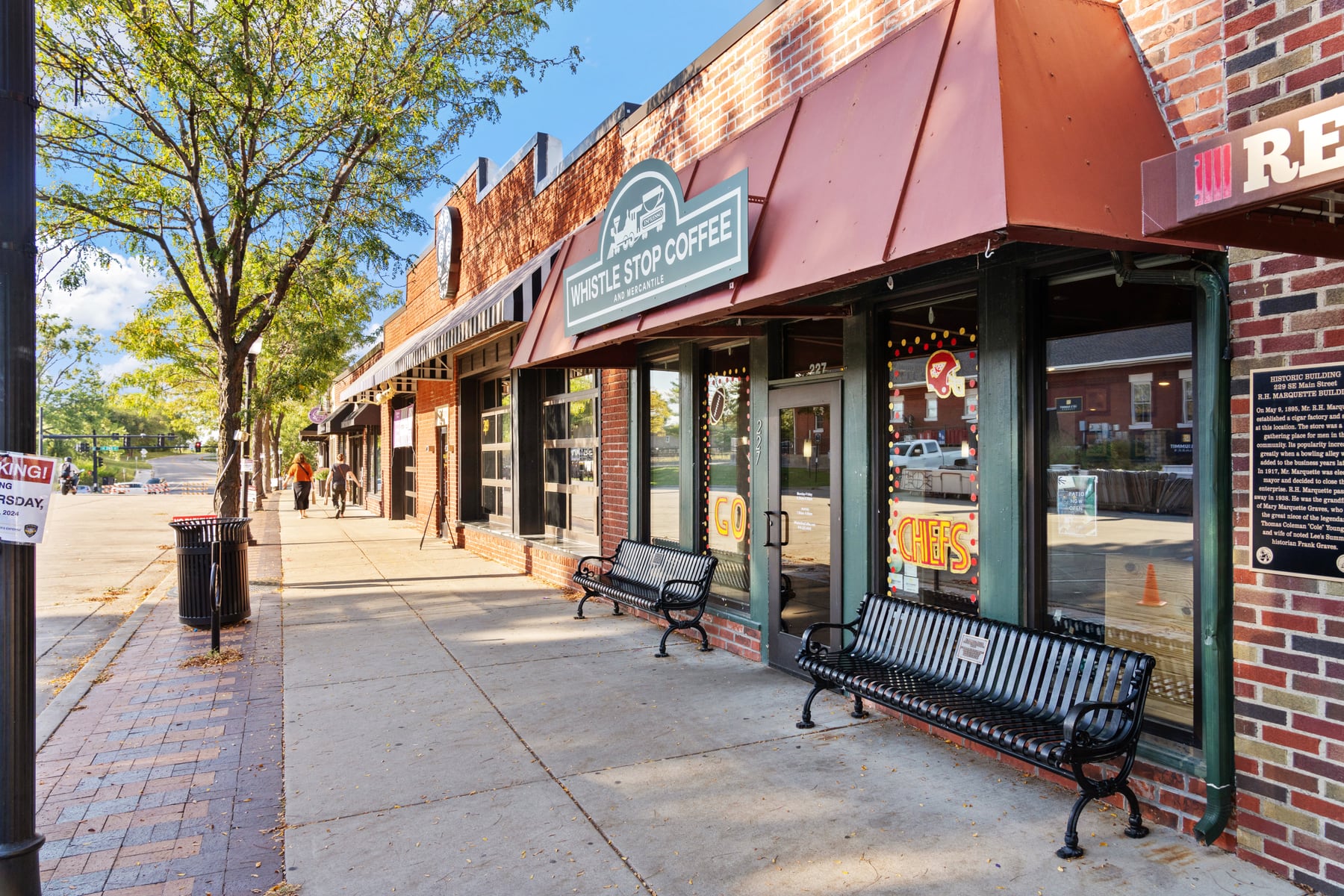 Walkable downtown Georgetown storefronts with benches and brick facades