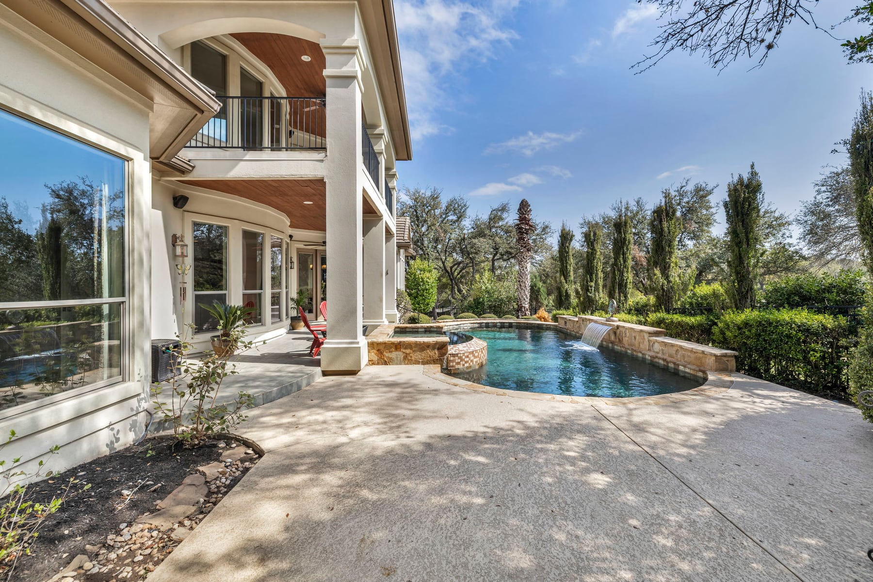 Quiet backyard pool and patio suited to low-maintenance Central Texas living
