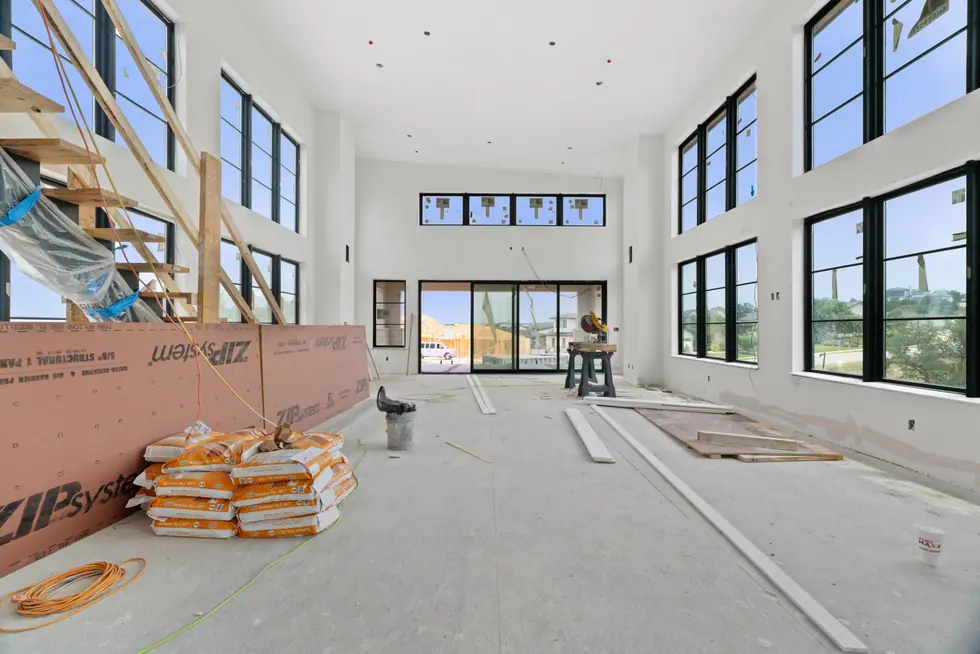 Double-height Casasanta living room progressing through interior construction