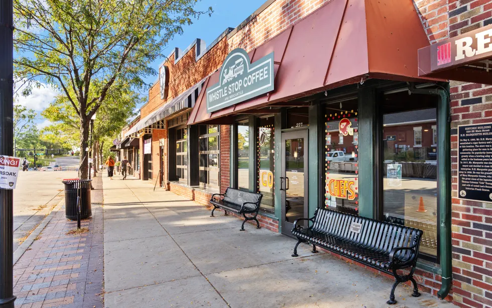 Walkable downtown Georgetown storefronts with benches and brick facades