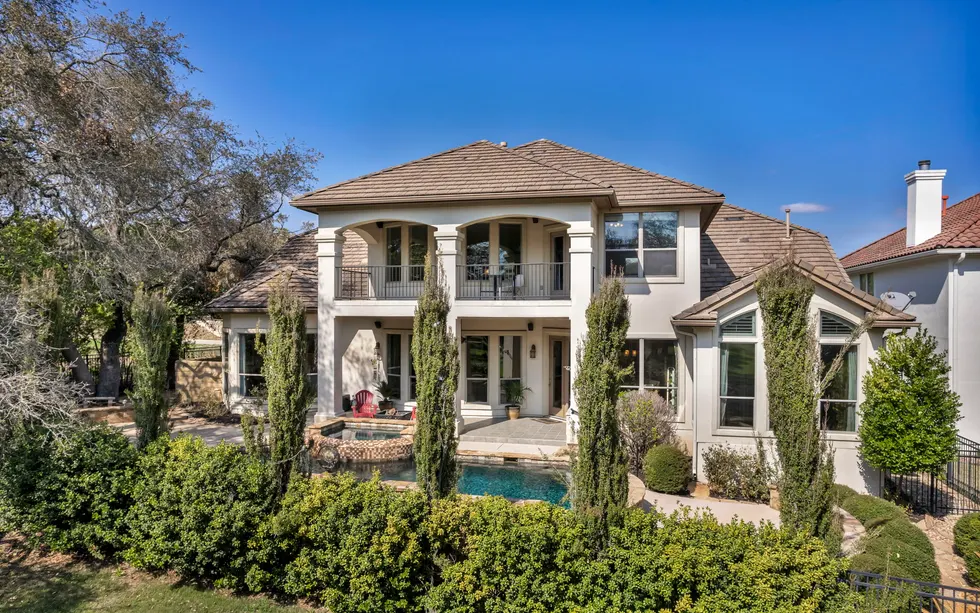 Upscale Central Texas home exterior with mature landscaping