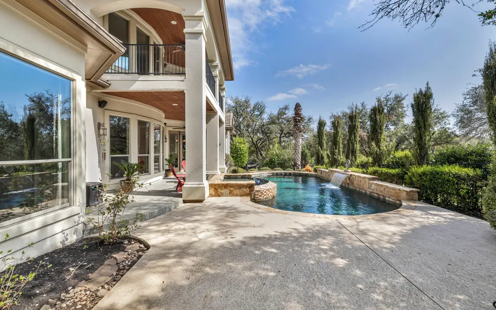 Quiet backyard pool and patio suited to low-maintenance Central Texas living