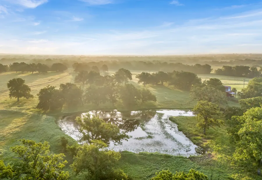 Morning light over pasture, ponds, and rural land near Granger