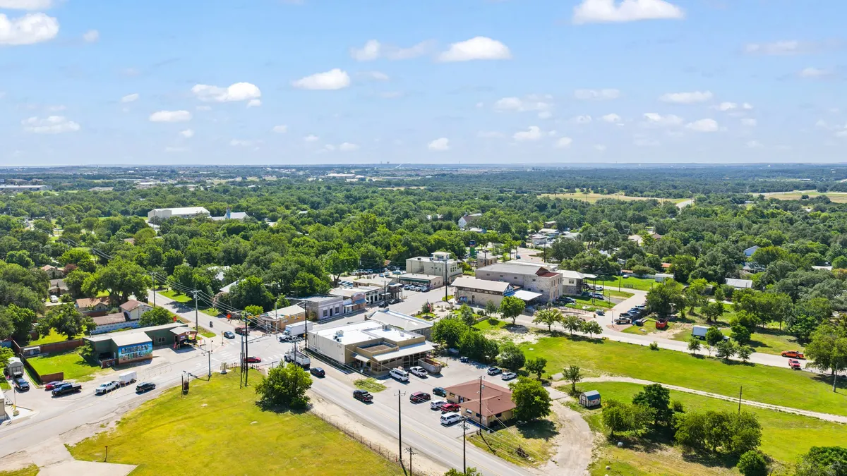 Aerial view over downtown Liberty Hill and the surrounding Hill Country landscape