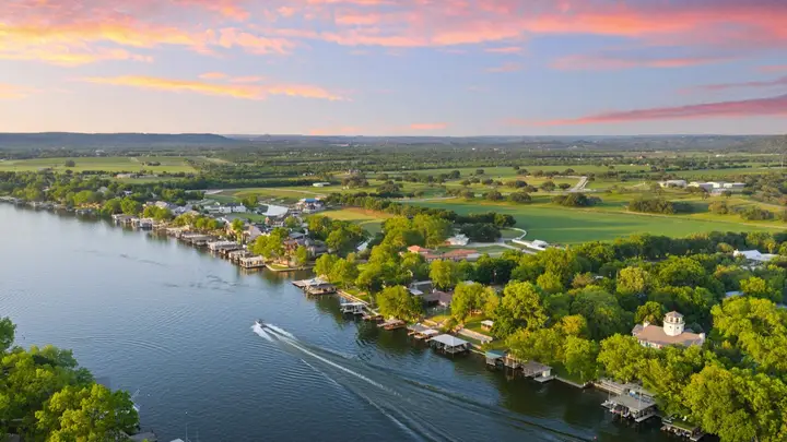 Drone view of Central Texas lake-area homes and shoreline