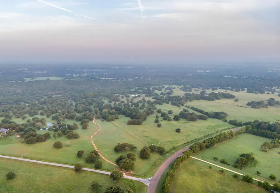 Open rural pasture and tree-lined acreage near Thrall in east Williamson County