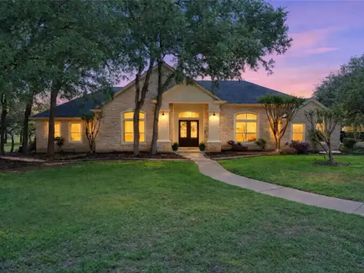 Stone home at 113 Ten Oaks Drive in Georgetown at sunset