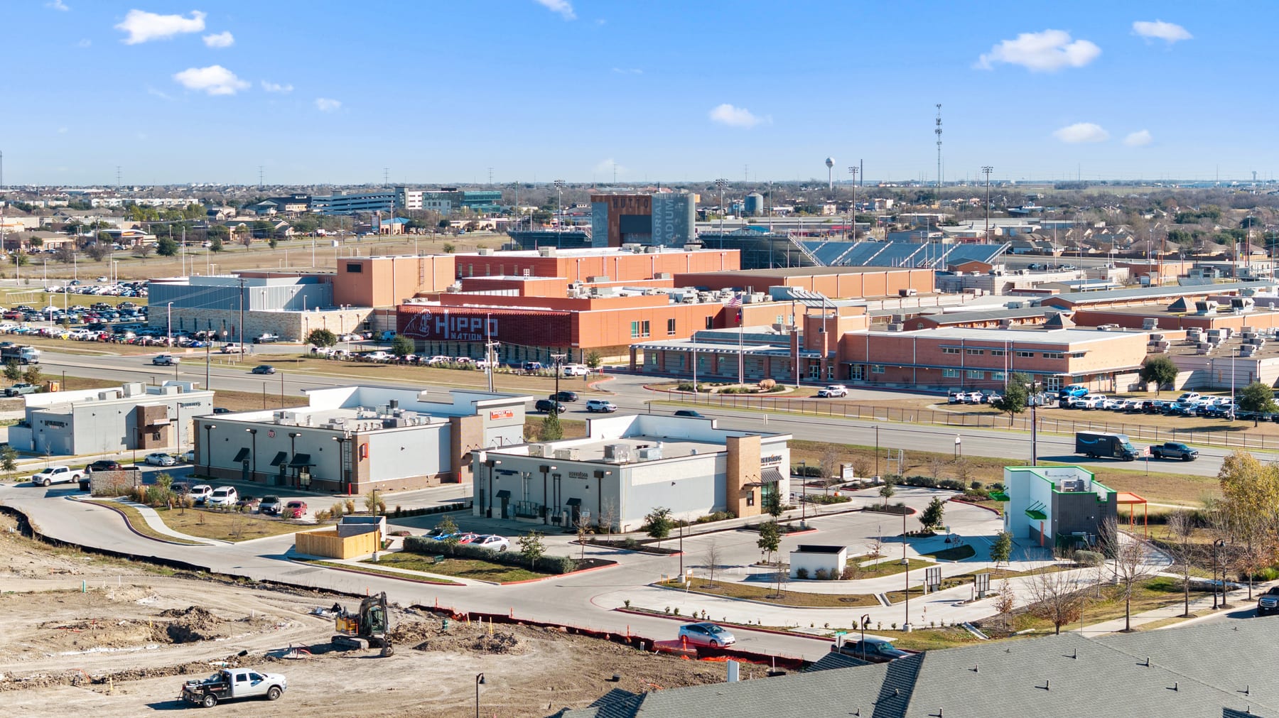 Aerial view of Hutto school and community growth corridor with nearby retail and roads