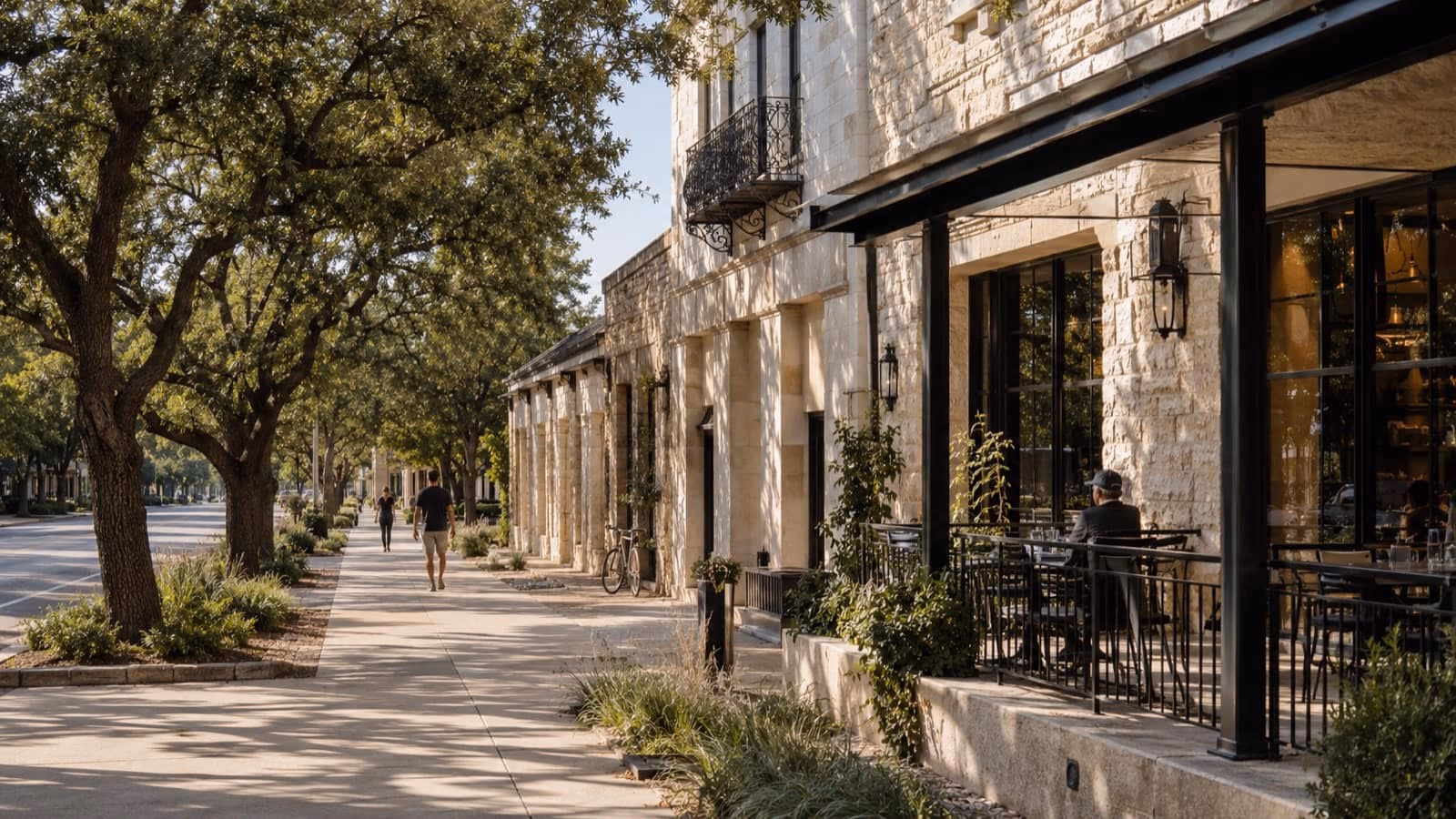 Walkable Georgetown streetscape with limestone storefronts and mature trees