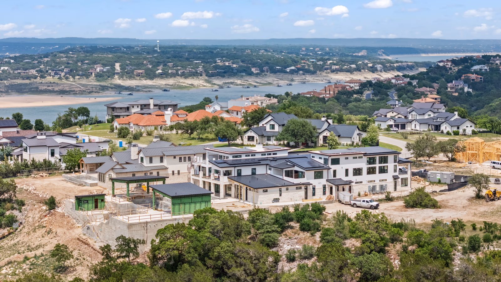 New homes under construction above a Central Texas lake community