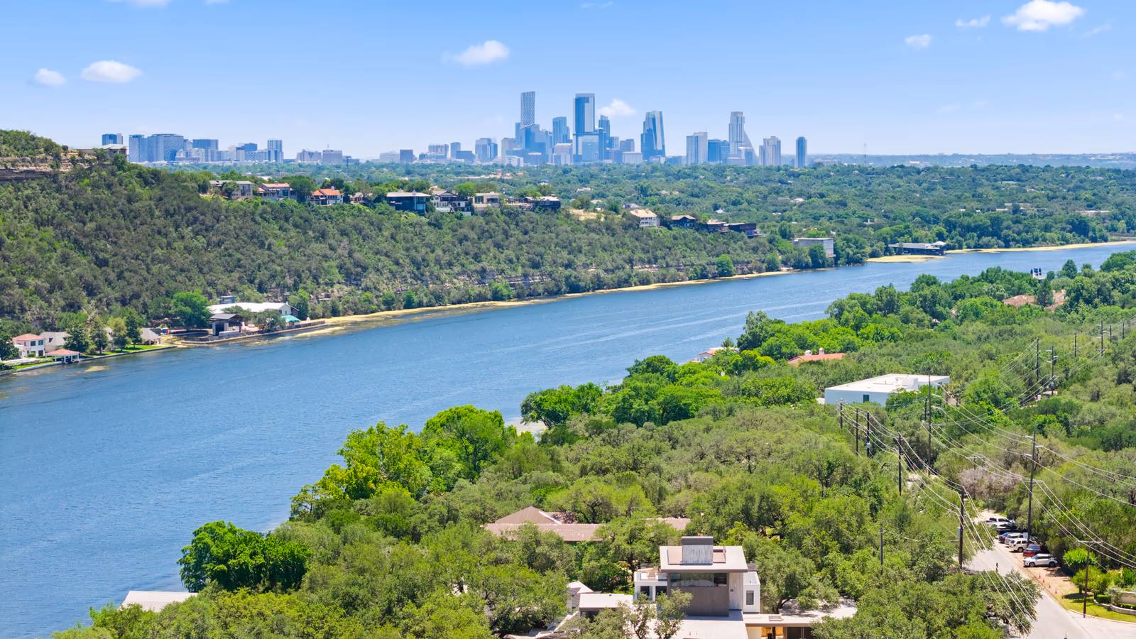 Austin skyline beyond the Colorado River and surrounding Hill Country