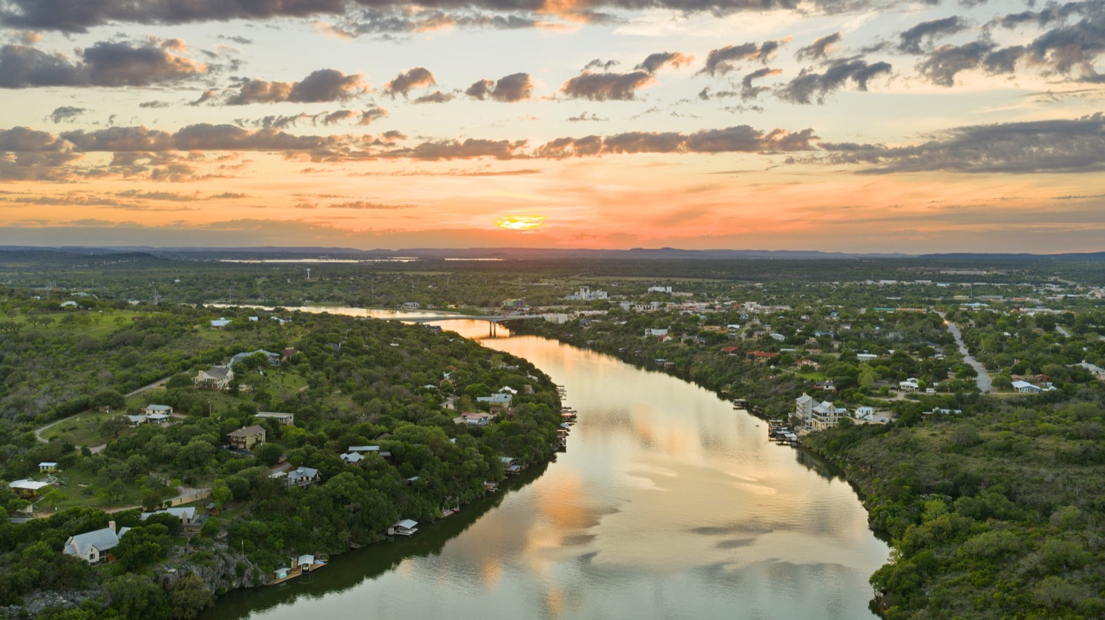 Highland Lakes waterway and shoreline glowing at sunset