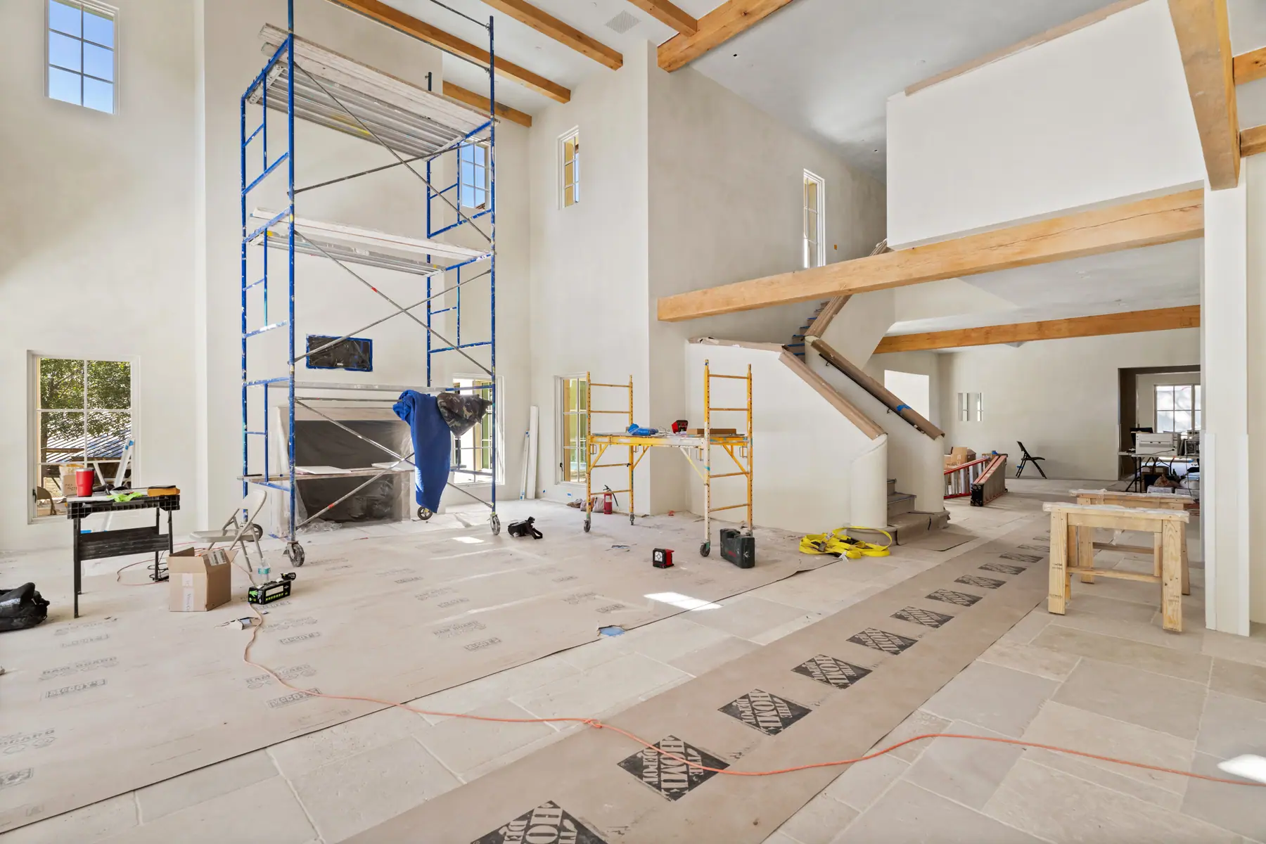 Hutto-area new construction interior with finish work and scaffold in place