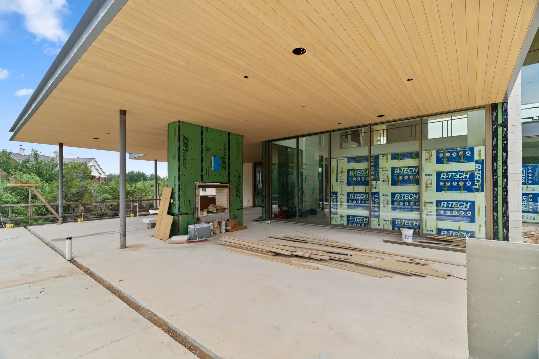 Modern Central Texas new construction home exterior with unfinished patio work